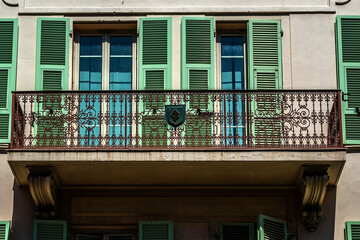 Fototapeta na wymiar Detail of some windows and balcony in Principality of Monaco. Monte-Carlo.
