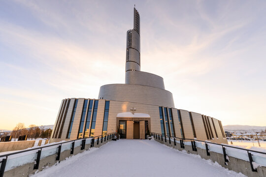 Northern Lights Cathedral, titanium clad, deep snow in winter, sunset, Alta, Troms og Finnmark