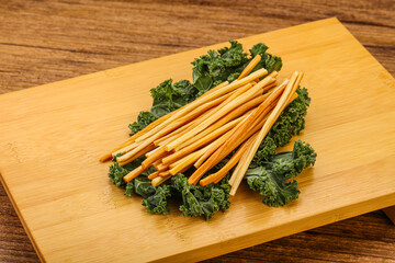 Chechel cheese sticks over board