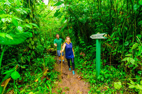 Couple and woman hiking through the jungle on Saba Island, Netherlands Antilles