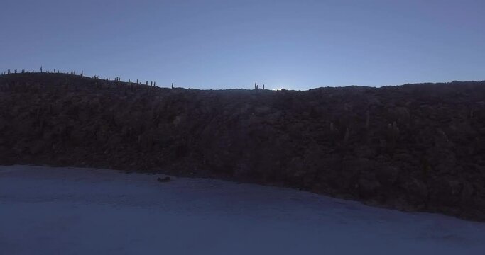 Unreal Cacti Island in Uyuni Salt Flat at Sun Rise Travelling Aerial shot