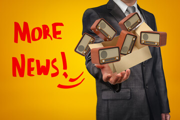 Businessman holding cardboard box filled with retro radio sets and 'More news' sign on yellow background.