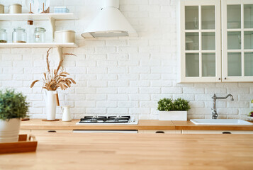 Kitchen wooden table top and kitchen blur background interior style scandinavian