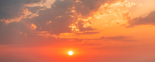 Beautiful colorful sunset sky with orange clouds. Nature sky background.