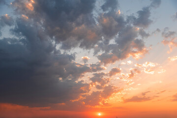Beautiful colorful sunset sky with orange clouds. Nature sky background.