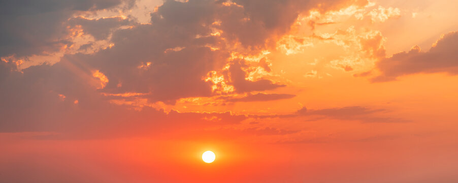 Beautiful colorful sunset sky with orange clouds. Nature sky background.