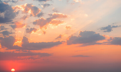 Beautiful colorful sunset sky with orange clouds. Nature sky background.