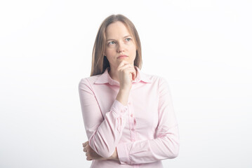 young Businesswoman thinking looking up at copy space. Young Caucasian professional woman isolated...