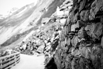 old stone wall on a footpath at the Grossglockner in the austrian alps