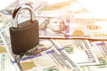 Money saved. American money. Washington American cash with padlock isolated on white, usd background