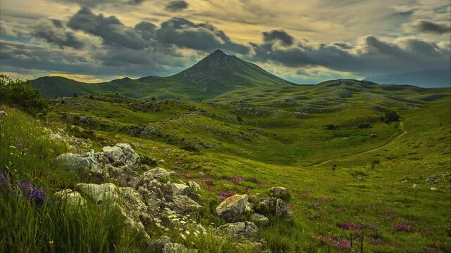 rocky mountain with a dramatic cloudy sky. Fast movement of clouds in timelapse in the Gran Sasso and Monti della Laga National Park