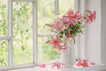 summer flowers in vase on white windowsill