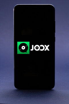Belgorod , Russia - MAY, 16, 2020: Mobile phone with Joox logo on screen, Stream music Songs application