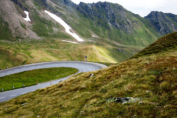 Fototapeta premium spectacular colorful view of mountain landscape with clouds and blue sky at the Grossglockner and the High Alpine Road in the austrian alps