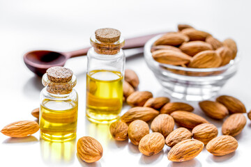 cosmetic and therapeutic almond oil on white background