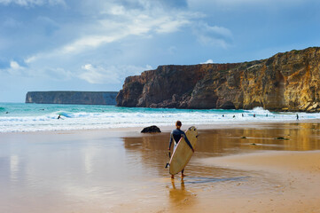 Surfer surfboard woman Portugal beach