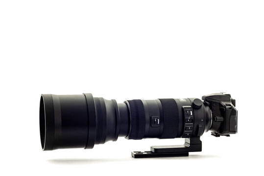 Fototapeta Modern DSLR Camera With Super Telephoto Zoom Lens On White