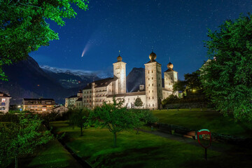 Comet C/2020 F3 Neowise in night sky over Stockalper castle in Brig, Valais, Switzerland