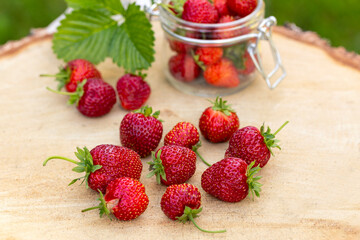 Fresh strawberries on a wooden table. Farmed organic food. Healthy eating.