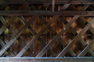 Inside view of the wood trusses in the historic wooden covered Cabin Run bridge in Plumstead, Bucks County, Pennsylvania, United States.