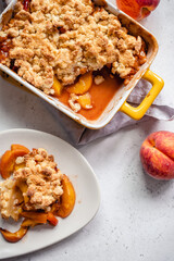 Peach cobbler dessert in a baking dish