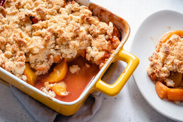 Peach cobbler dessert in a baking dish