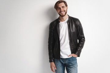 Fashion man, Handsome serious beauty male model portrait wear leather jacket, young guy over white...