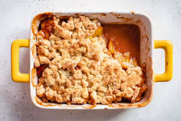 Peach cobbler dessert in a baking dish