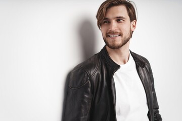 Fashion man, Handsome serious beauty male model portrait wear leather jacket, young guy over white background