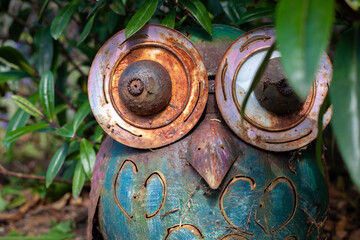Rusty Metal Owl Hiding in Bushes