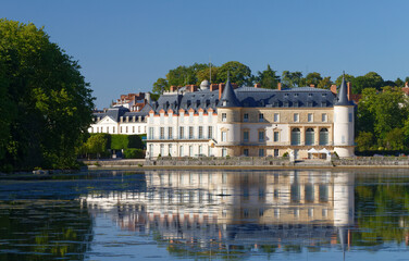 View of Rambouillet castle , XIV century, in picturesque Public Park in town of Rambouillet , 50 km southwest of Paris. France. - obrazy, fototapety, plakaty