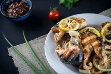 fried fish with herbs and lemon