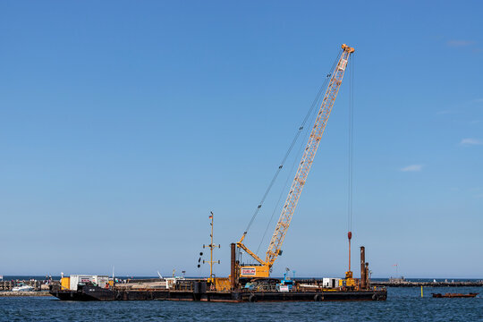 ROSTOCK, GERMANY - JUNE 14, 2020: Z&uuml;blin pontoon in the Warnow estuary. Ed. Z&uuml;blin AG, based in Stuttgart, is a German construction company and part of the Austrian Strabag group.