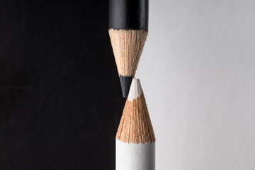 White and black pencils. Contrast and opposite concept