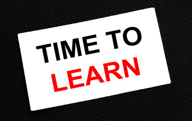 White card on the black background with text Time To Learn