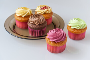 different cupcakes on a light glass surface