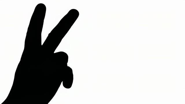 Silhouetted shot: a woman's hand making the victory sign, showing the palm and two raised fingers (positive, good gesture).
