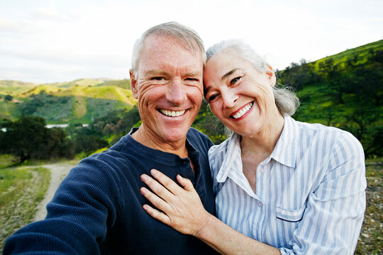 Caucasian couple standing on hiking trail