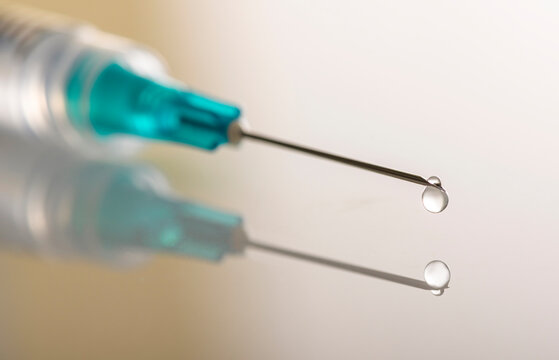 Liquid drop on top of syringe needle