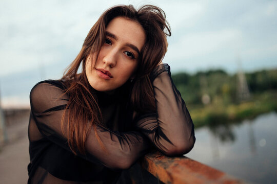 Belarus, Brest, Portrait of young woman on bridge over river