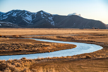 USA, Idaho, Picabo, Landscape with Silver Creek fields and mountain range