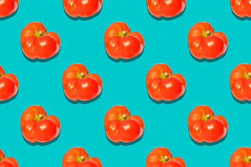Seamless pattern with an ugly tomato on a light green background. Drawing for packaging, wallpaper, advertising.