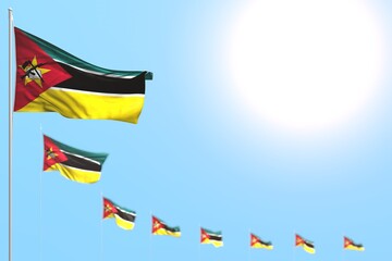 pretty many Mozambique flags placed diagonal with bokeh and free space for your text - any holiday flag 3d illustration..