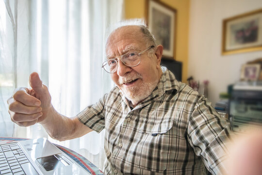 Elderly Man Is Taking A Selfie Photo At Home
