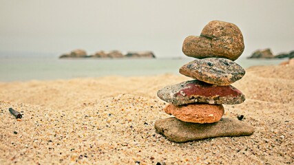 Fototapeta na wymiar Zen like stone heap on the beach. Relaxation