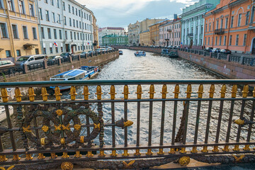 Naklejka premium Decorative fence of Great Konyushenny Bridge above Moika River. Saint Petersburg, Russia