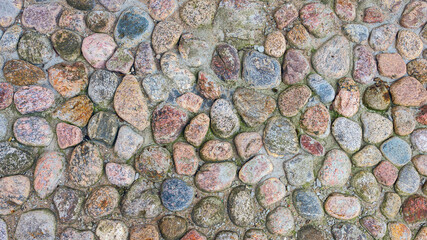 cobblestone pavement made of round stone around the ancient Peter and Paul Fortress in St. Petersburg, Russia