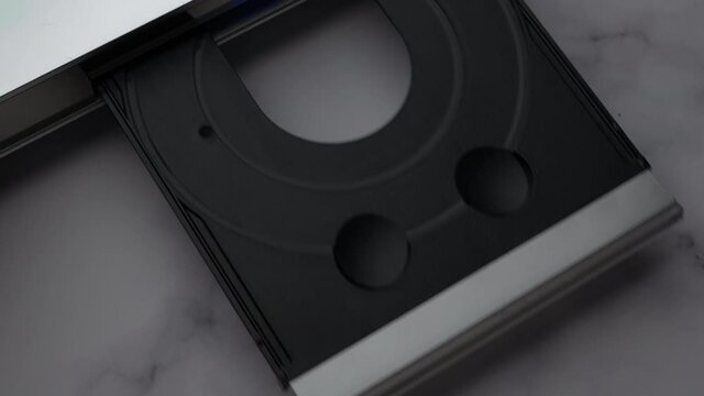 Top View DVD Disc, Eject Tray And Insert Disc In DVD-player. Man Of Hand Loads Disc Into The Device DVD/CD Player.