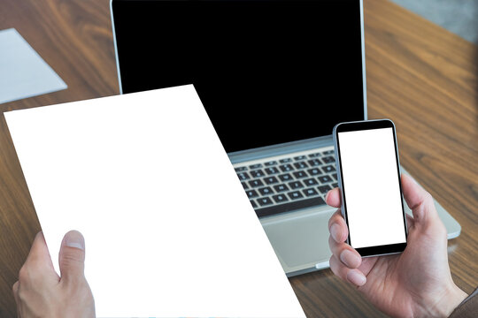 Mock up image of businessman hands holding blank screen smart phone and paper