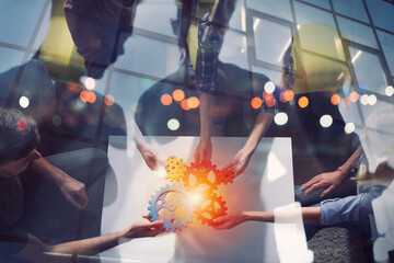 Business team connect pieces of gears. Teamwork, partnership and integration concept